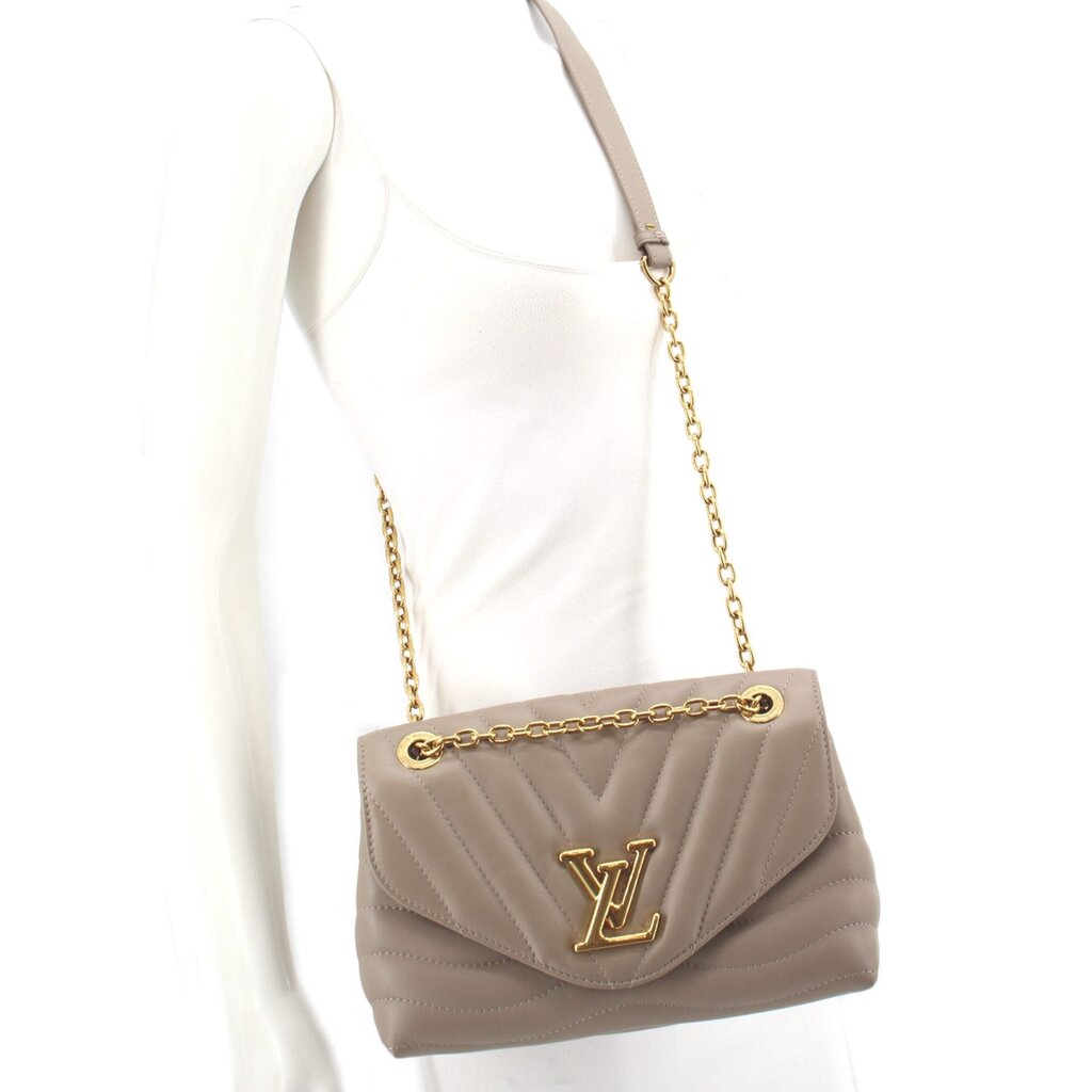 Taupe quilted mini shoulder bag worn crossbody with gold chain strap and logo flap