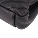SAINT LAURENT black leather crossbody bag close-up with stitched quilted panel
