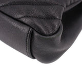 SAINT LAURENT black leather crossbody bag close-up with stitched quilted panel