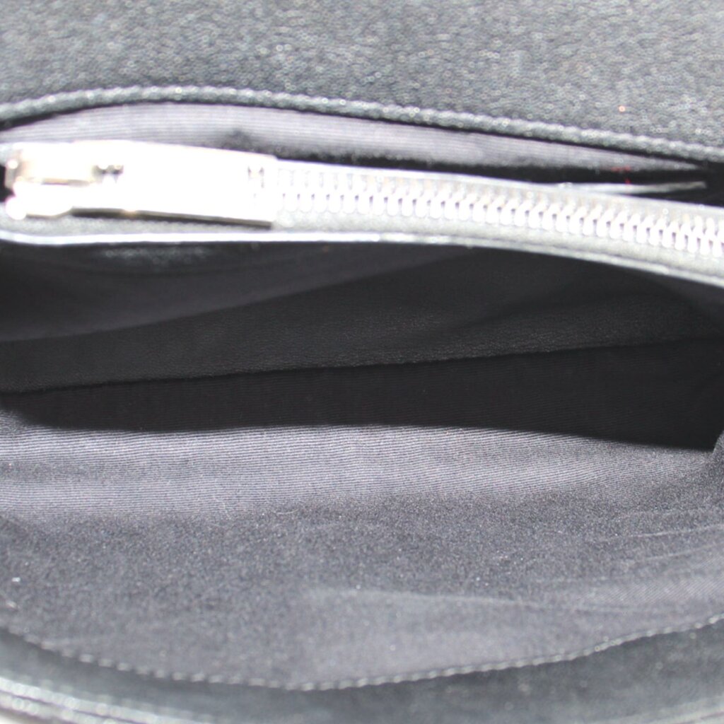 SAINT LAURENT crossbody bag interior with visible top zipper and fabric lining