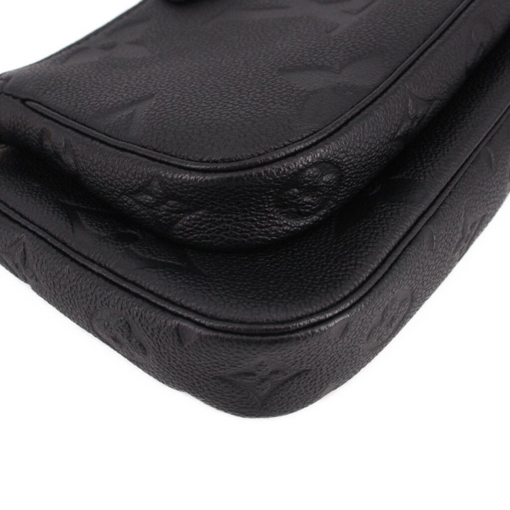 LOUIS VUITTON black embossed leather flap detail with curved seam and stitching