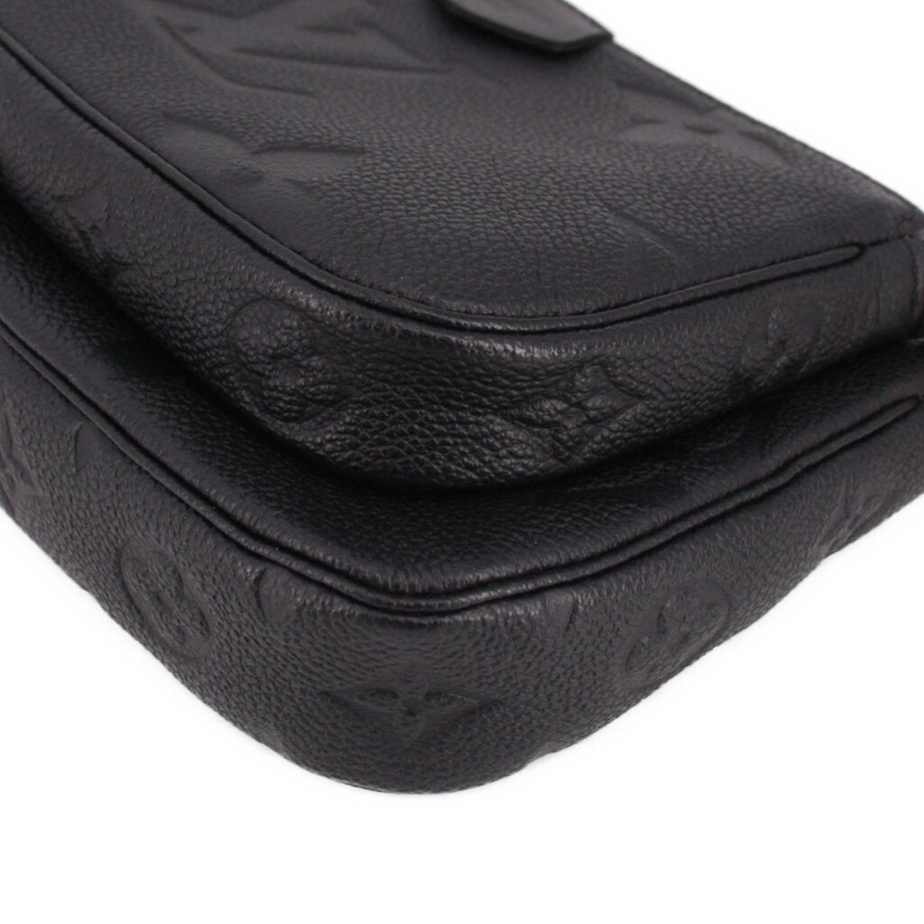 LOUIS VUITTON black embossed leather flap corner with rounded seam and stitching