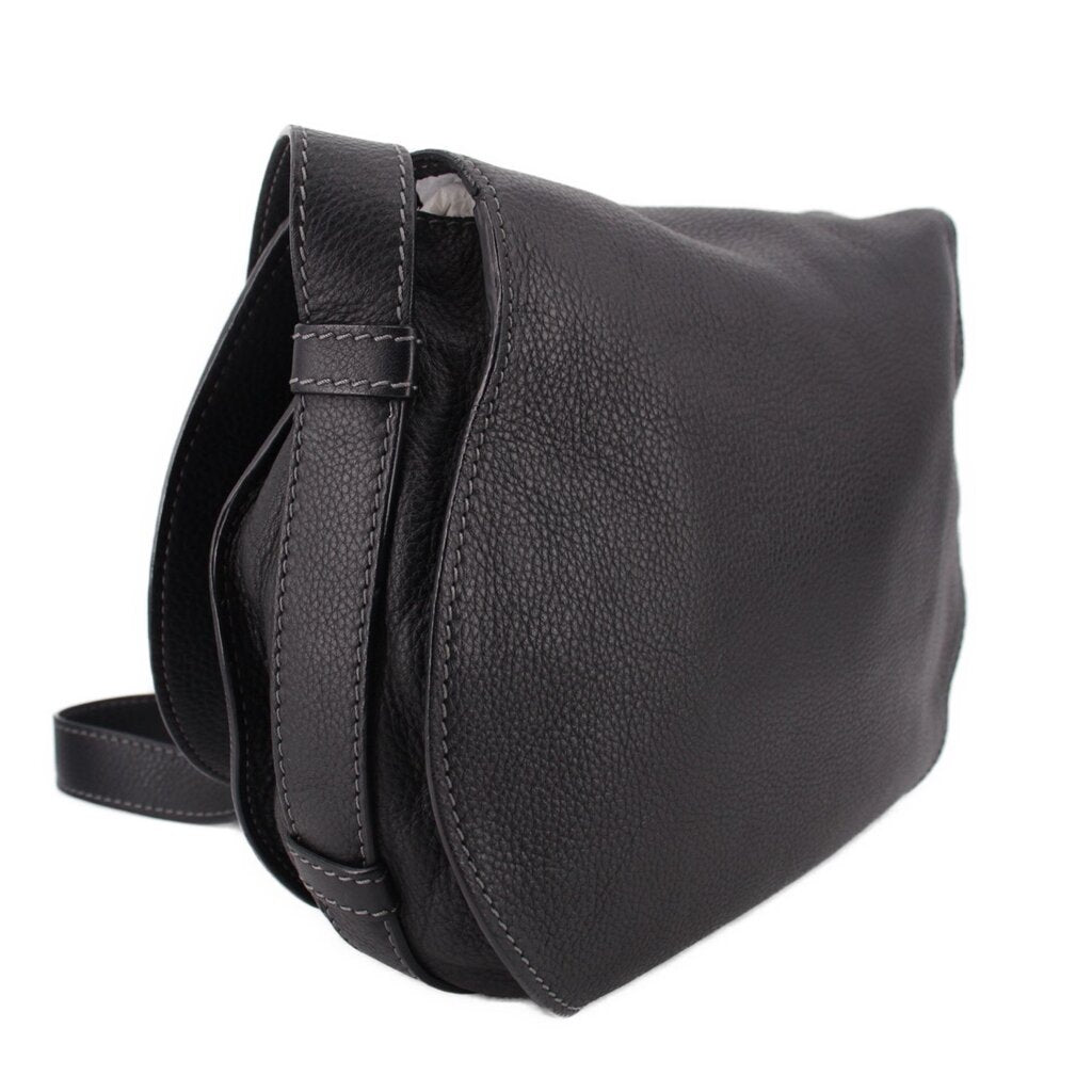 Black saddle crossbody bag with top handle and adjustable shoulder strap