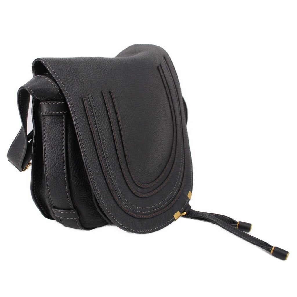 Black saddle crossbody bag side view with stitched trim and adjustable strap