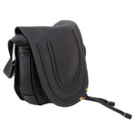 Black saddle crossbody bag side view with stitched trim and adjustable strap