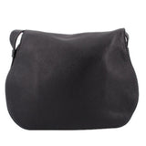 Black saddle crossbody bag front view with curved flap and textured leather look