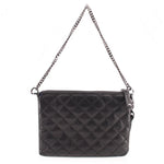 Black quilted leather crossbody bag with top zipper and chain shoulder strap