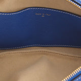 Inside lining of blue leather shoulder bag showing 'MADE IN ITALY' stamp