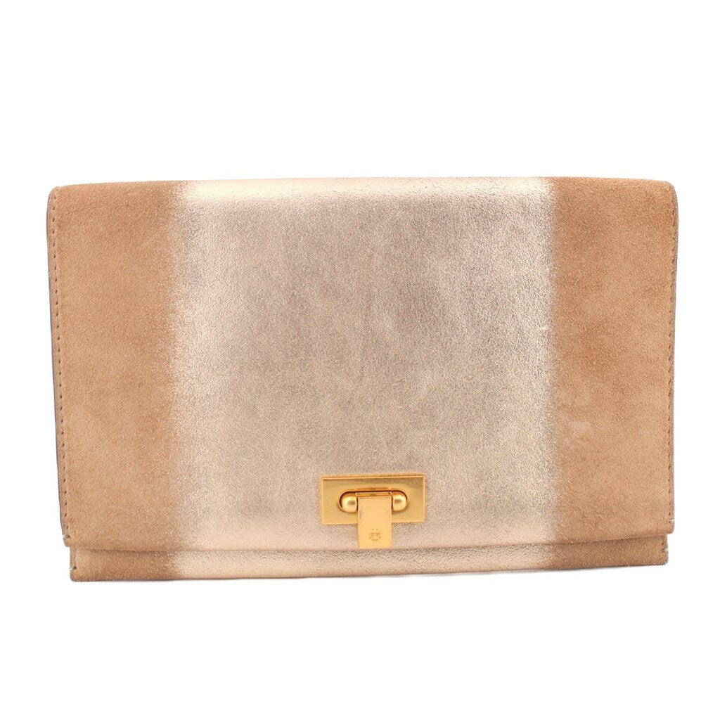 Tan foldover clutch with gold-tone logo turn-lock clasp.