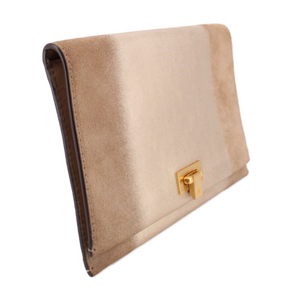 Tan foldover clutch, side view, with gold-tone turn-lock clasp.