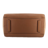 Brown leather tote bag back panel with reinforced tabs and structured top