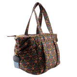 Floral quilted tote bag with side pocket flap and adjustable crossbody strap