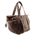 Floral quilted tote bag with side pocket and adjustable crossbody strap