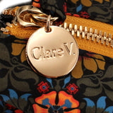 Clare V round metal logo zipper pull on floral tote