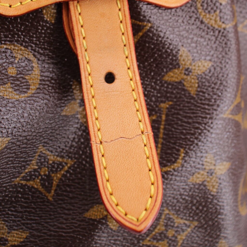 LOUIS VUITTON Tivoli GM monogram bag close-up of leather strap and yellow stitching