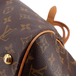 LOUIS VUITTON Tivoli GM monogram bag close-up of side seam and leather corner stud