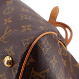 LOUIS VUITTON Tivoli GM monogram bag close-up of side seam and leather corner stud