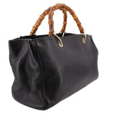 Black Gucci bamboo-handled shopper tote, angled view of front and side panels