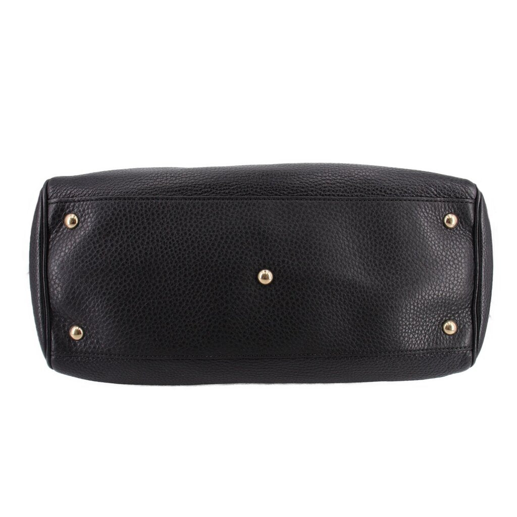 Black Gucci shopper tote with studded base feet and gold-tone hardware