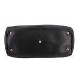 Black Gucci shopper tote with studded base feet and gold-tone hardware
