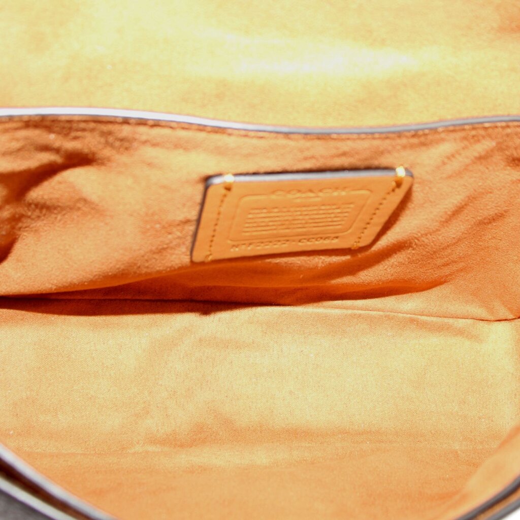 Bag interior lining with embossed logo patch near the top
