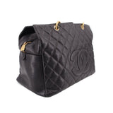 CHANEL grand shopper tote bag, dark quilted leather with stitched logo and gold hardware