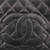 CHANEL embossed CC logo detail on dark quilted leather panel