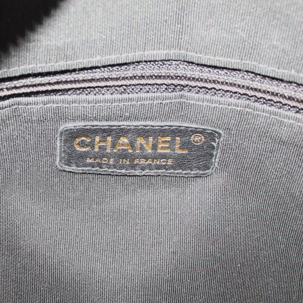 CHANEL tote interior label reading CHANEL and Made in France on gray fabric