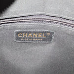 CHANEL tote interior label reading CHANEL and Made in France on gray fabric