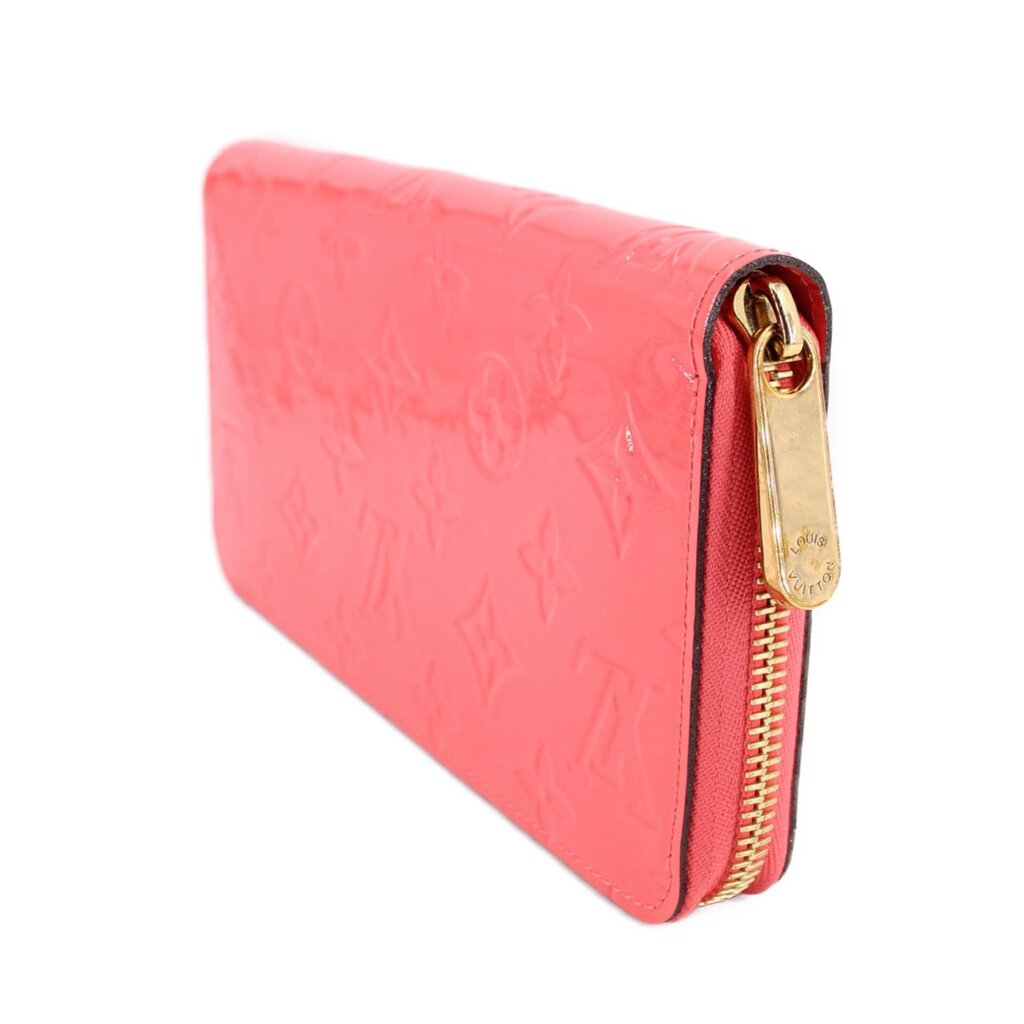 Coral patent leather zip wallet with gold-tone hardware on side flap