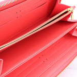 Coral leather zip wallet interior with card slots and lined compartments