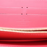 Coral interior lining with Louis Vuitton Paris stamp and zip track detail