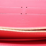 Coral interior lining with Louis Vuitton Paris stamp and zip track detail