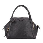 Louis Vuitton Marais MM handle bag in black leather with gold hardware and zipper.