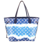 Blue tie-dye Neverfull tote with repeating Louis Vuitton logos and dark leather corner tabs