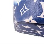 Blue tie-dye Neverfull corner with textured canvas and white Louis Vuitton monogram print