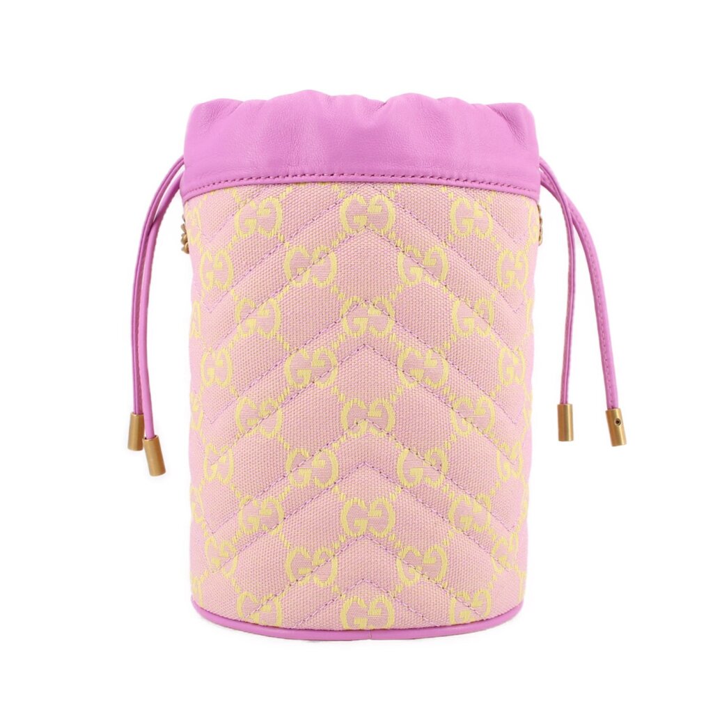 Pink mini bucket crossbody with GG monogram allover print and drawstring-style cords.