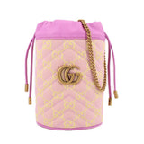 Pink mini bucket crossbody with GG monogram print, gold G emblem, and braided chain strap.