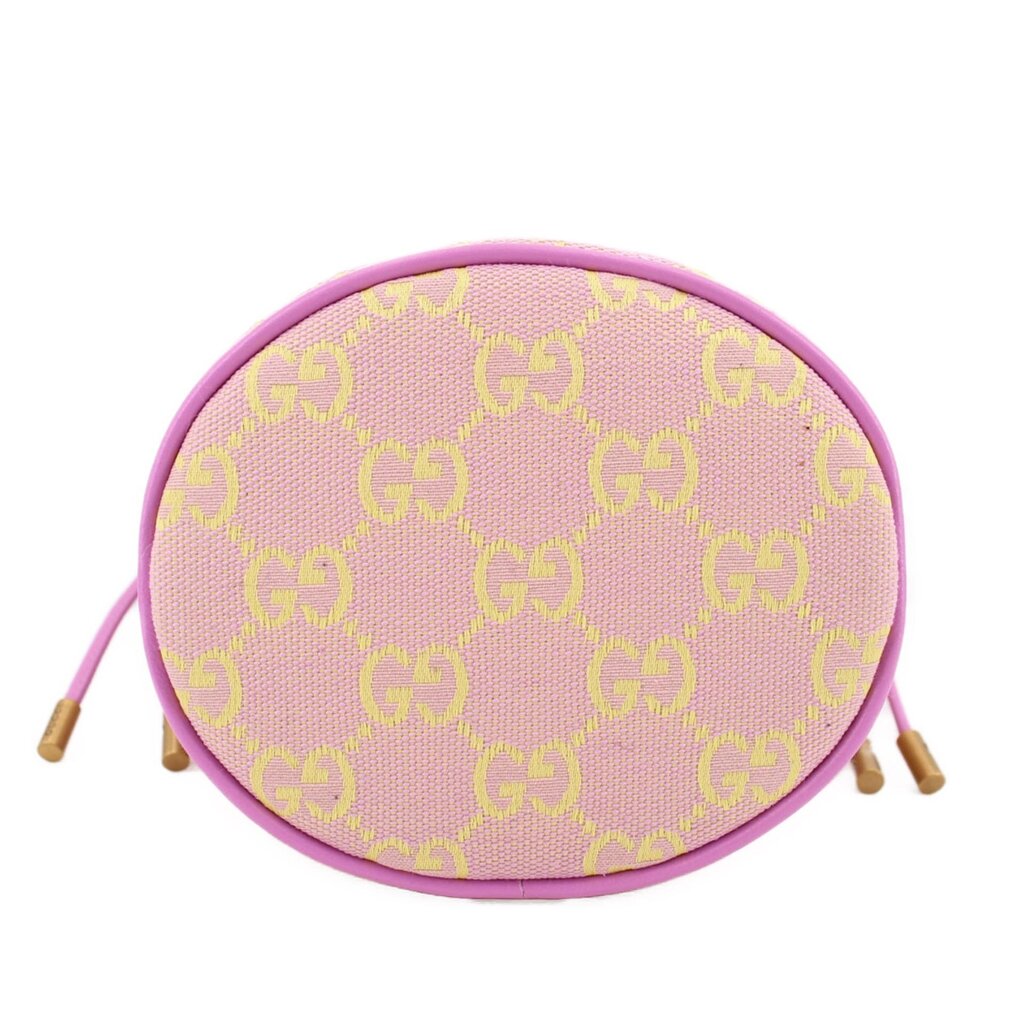 Pink mini bucket crossbody showing top-oval opening with GG monogram pattern and trim.