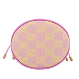 Pink mini bucket crossbody showing top-oval opening with GG monogram pattern and trim.