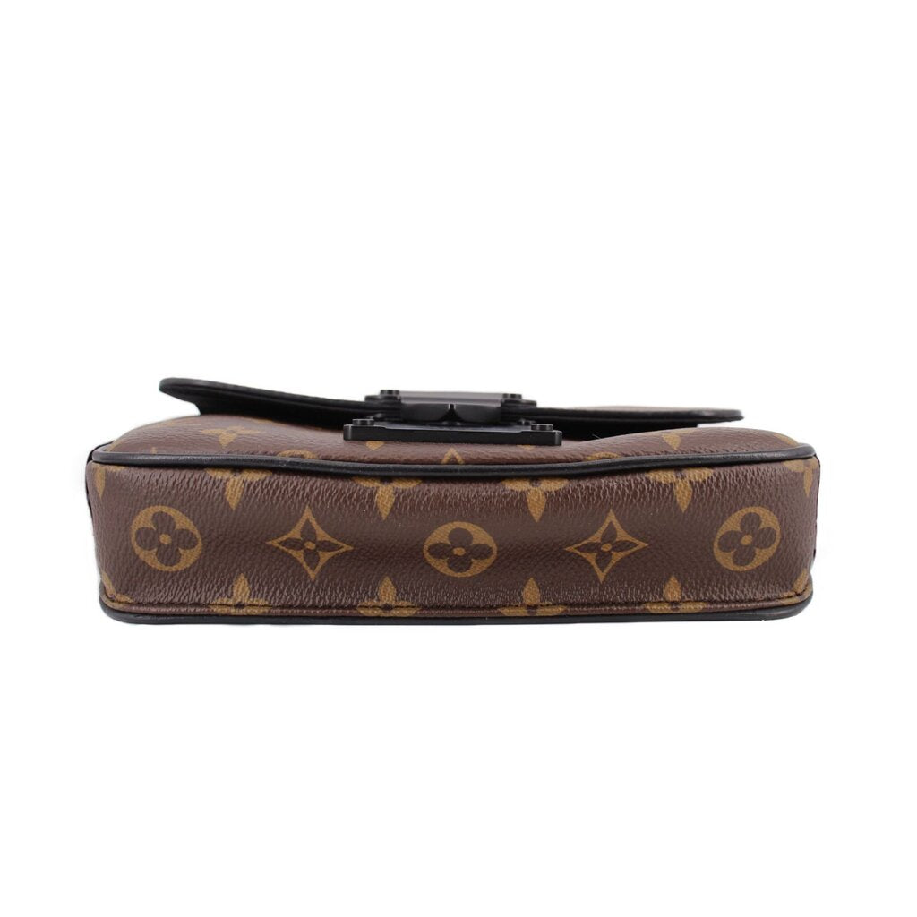 Monogram sling belt bag top view with black buckle and hardware