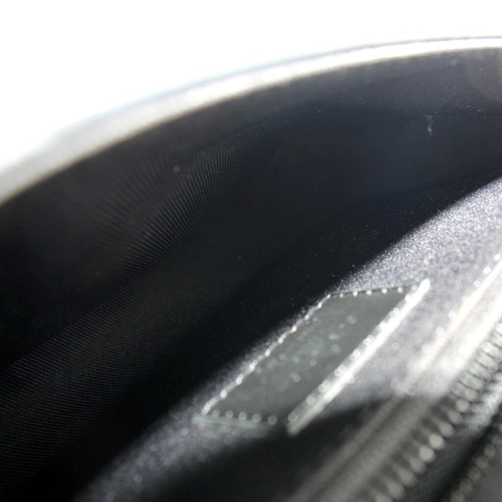 Monogram sling belt bag interior lining close-up in dark fabric
