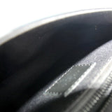 Monogram sling belt bag interior lining close-up in dark fabric