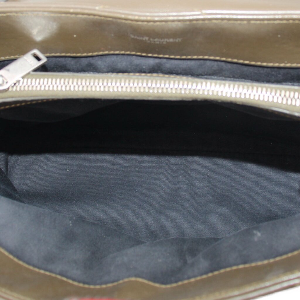 Olive puffer bag interior with zipper opening and fabric lining
