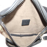 GUCCI belt bag interior close-up with tan lining and zipper at top edge