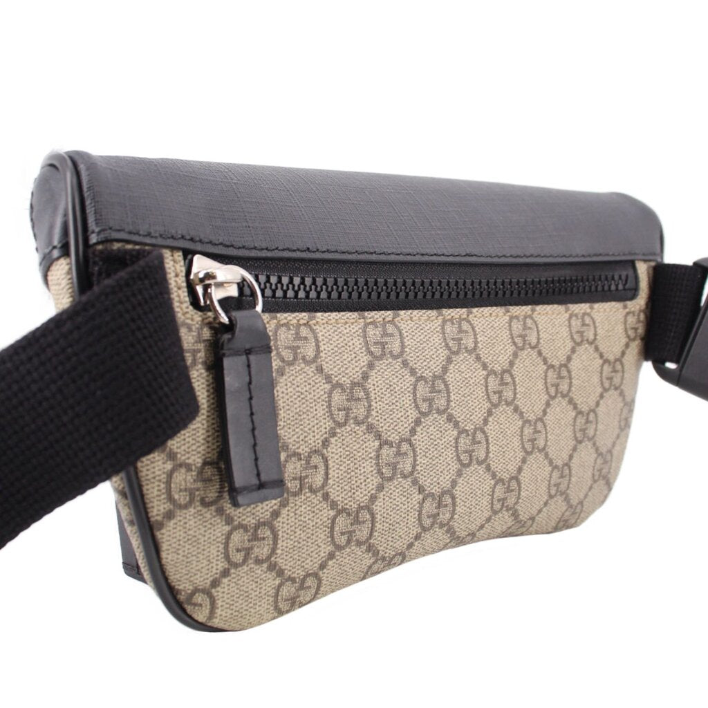 GUCCI belt bag close front, black top zipper and tan GG canvas body with strap