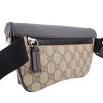 GUCCI belt bag close front, black top zipper and tan GG canvas body with strap