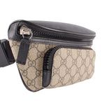 GUCCI belt bag with black zip, tan GG canvas front, and adjustable crossbody strap