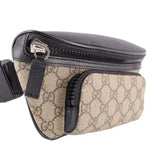 GUCCI belt bag with black zip, tan GG canvas front, and adjustable crossbody strap