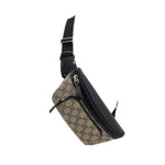 GUCCI belt bag angled view with tan GG canvas, black strap, and front zip closure